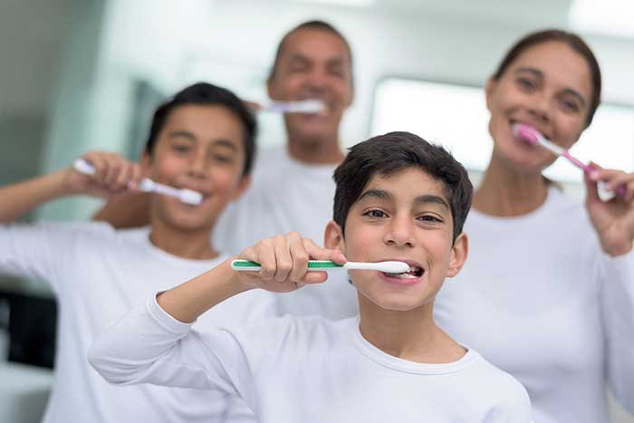 HTX Dentist Family Brushing Teeth